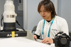 Takahiko Koizumi signs out loaner gear at the Sony Service Centre in Cortina at the Milan Cortina 2026 Winter Olympics.