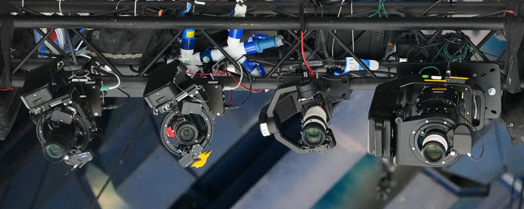 Robotic cameras set-up over the Paris 2024 Gymnastics Venue, AIR Robot the third from the left. Photo by Nick Didlick